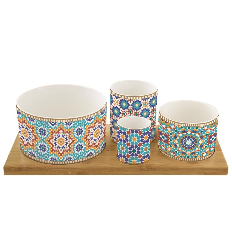 Appetizer set with 4 porcelain round bowls on bamb