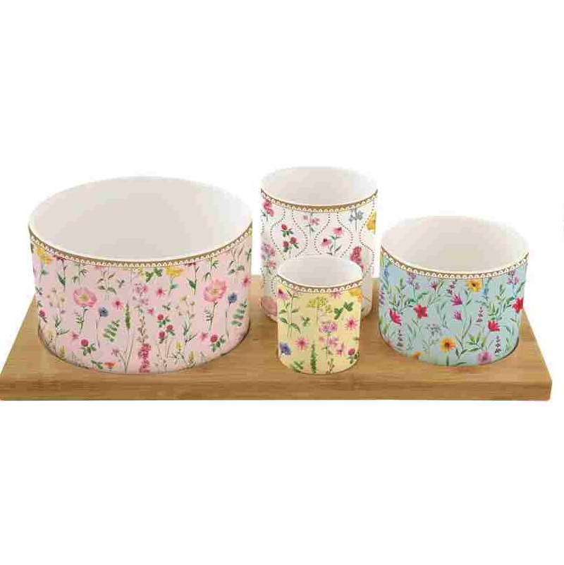 Appetizer set with 4 porcelain round bowls on bamb